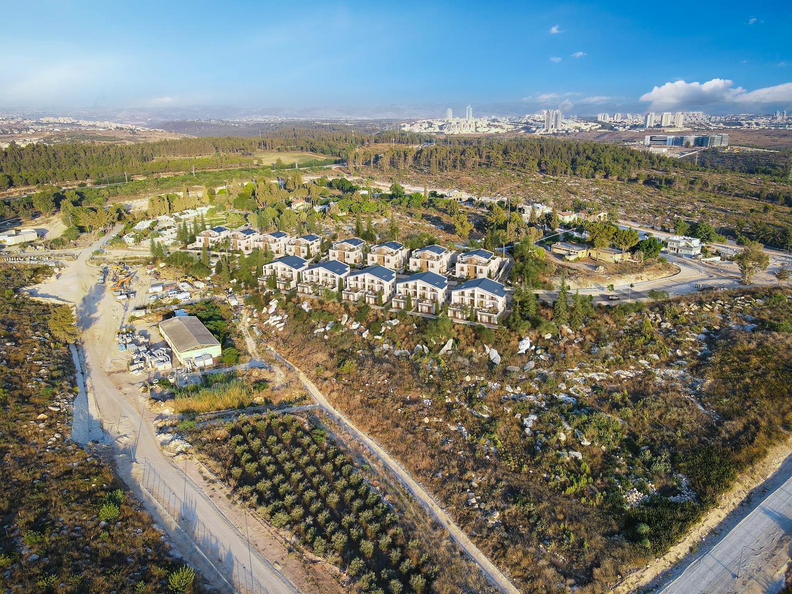 Aerial photograph of the Mevo Modi'im construction site with the Modi'in skyline on the horizon