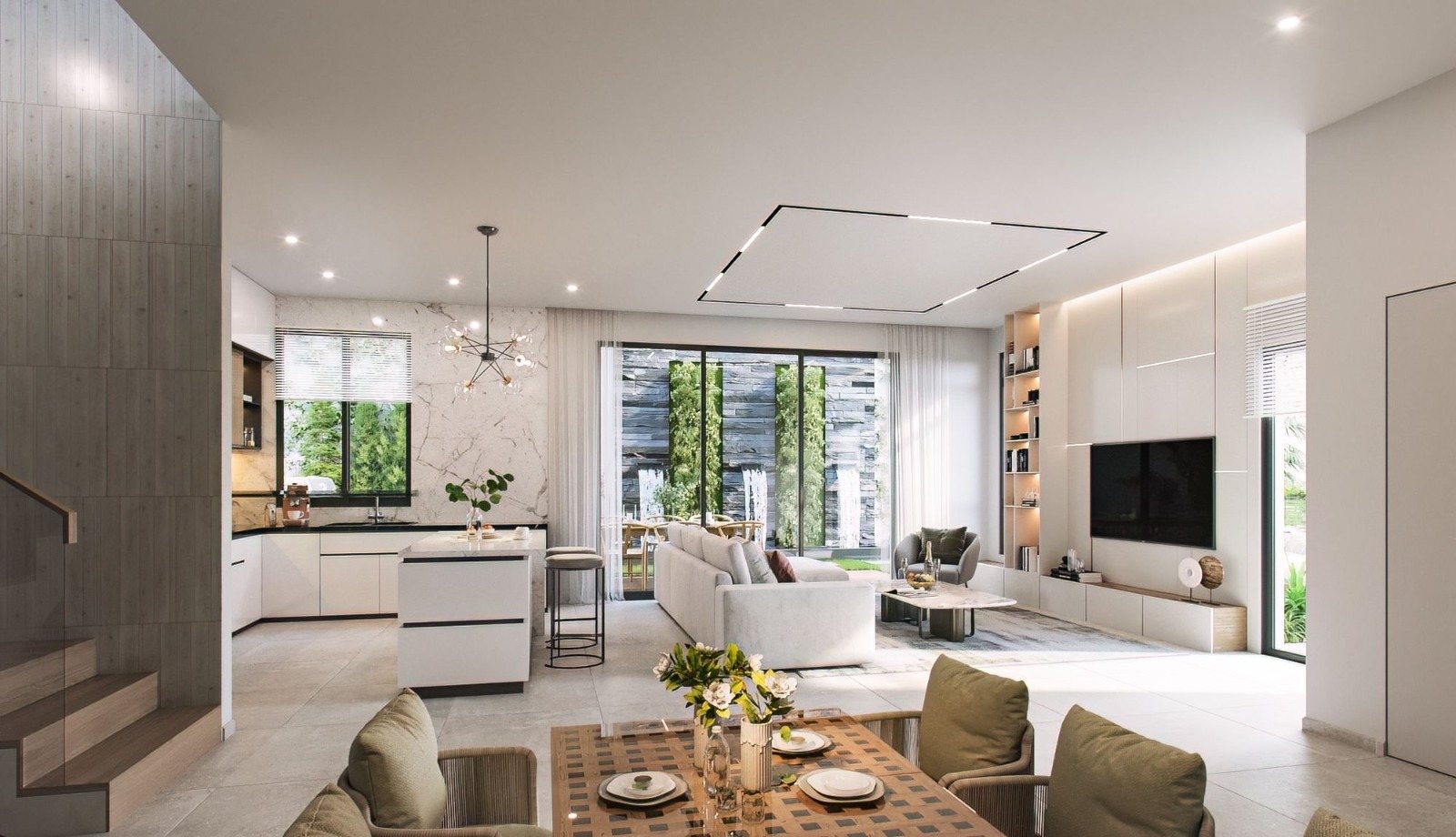 Living room opening onto a planted courtyard in a Mevo Modi'im residence