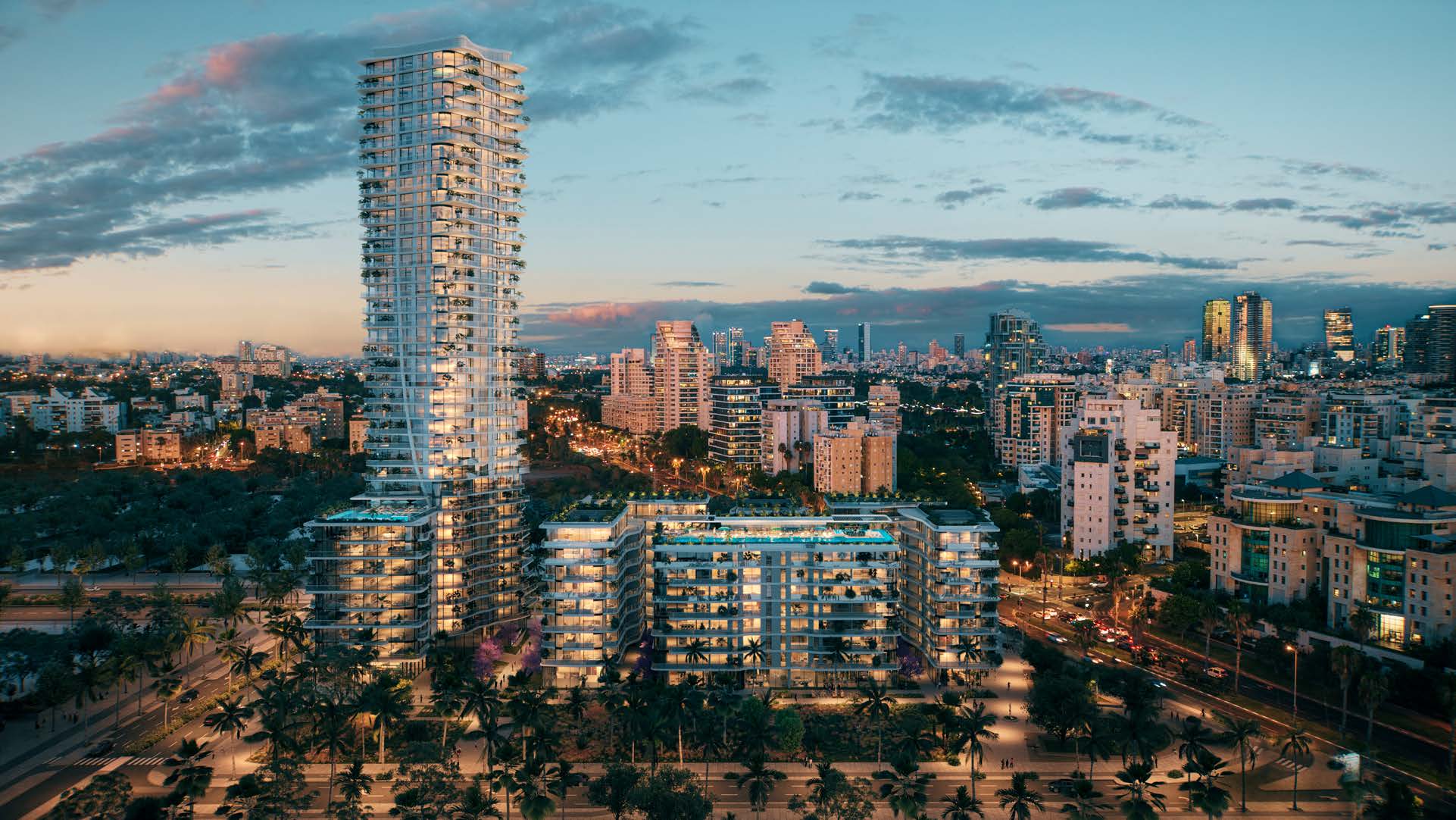 Night view of the glowing Rainbow Tel Aviv tower, a beacon of luxury on the North Tel Aviv coast