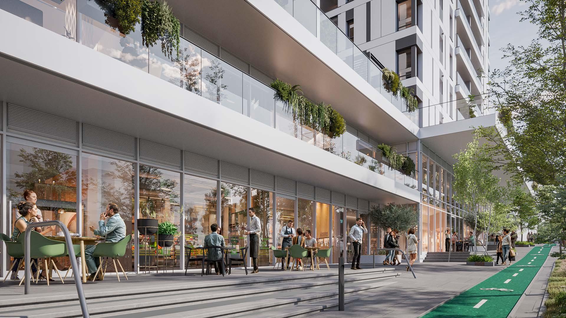 Vibrant urban retail and street-level cafe culture at the base of the U Towers in Bat Yam